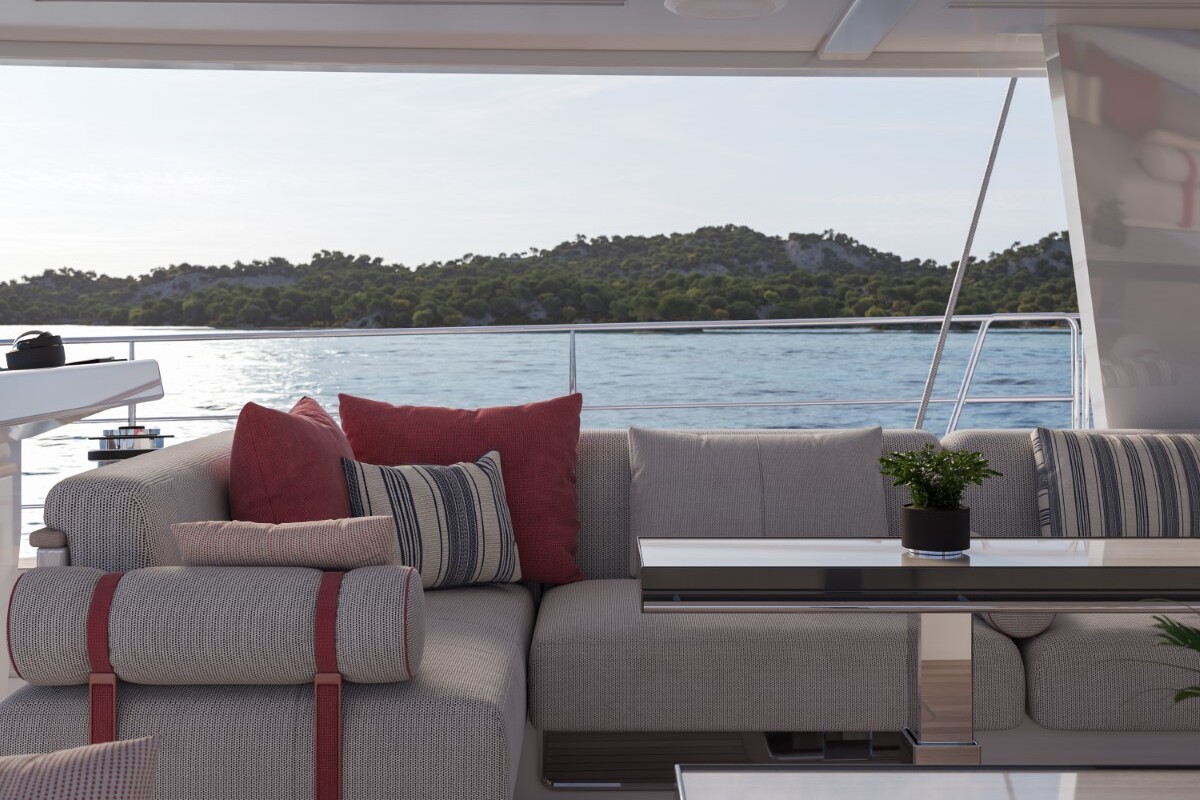 Meta Design Studio, Yacht Animation, 3D Animation, Yacht Rendering, 3D Rendering, Luxury Visualization, Yacht Visualization A cozy outdoor lounge on a yacht with gray cushioned seating, red and striped pillows, small potted plants on glass tables, and a scenic view of calm water and a tree-covered island in the background.